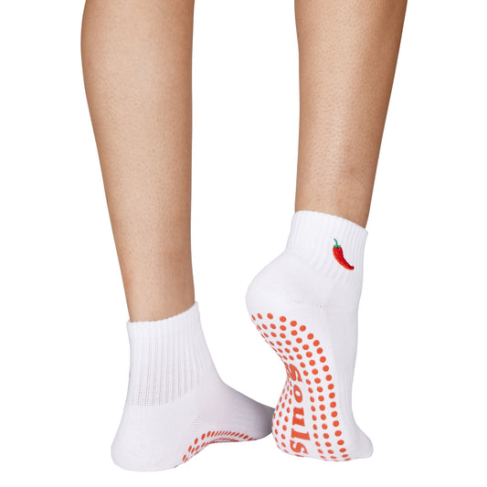 Spicy-themed grip socks showcasing the pink grippy bottom and ankle fit