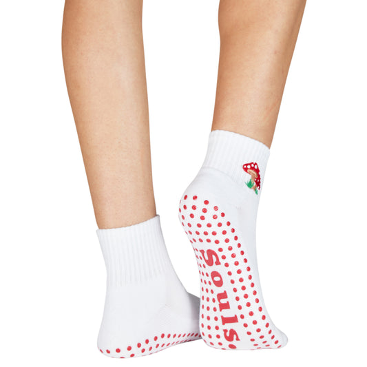 Playful mushroom-themed socks with red grip dots and ankle-high fit
