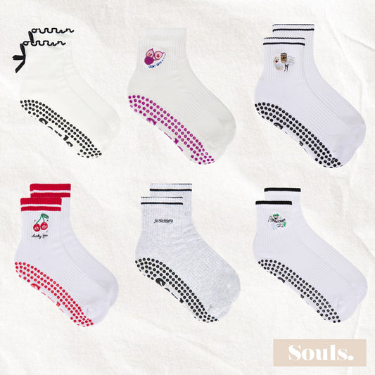 Cute Souls. LA grip socks collection featuring playful cherry, bow, and slogan designs in white, grey, and colorful accents.